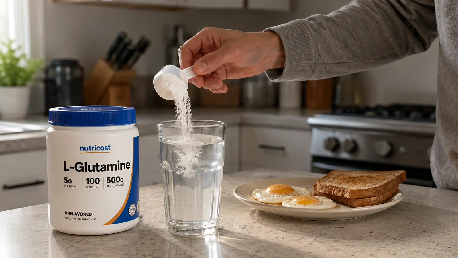 A hand scooping unflavored white powder into a glass of water on a kitchen counter next to a breakfast plate